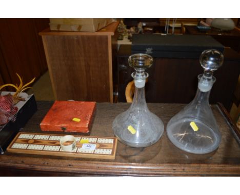 Two glass decanters; a cribbage board; a serviette ring; and a cased set of silver plated cake forks 
