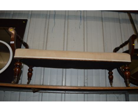 A mahogany and upholstered oblong stool 