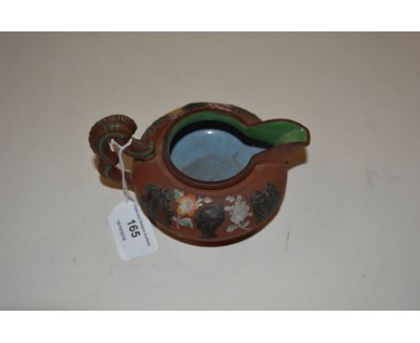 A Victorian terracotta and enamel decorated cream jug by Boothe &amp; May, Satffordshire circa 1839