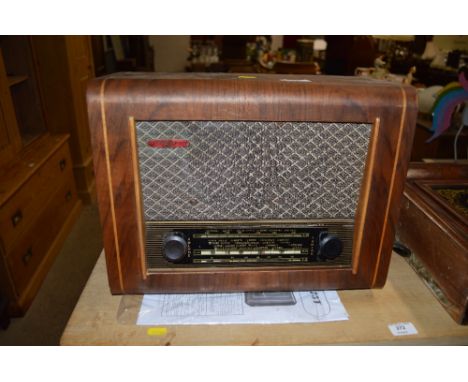 A Pye model P75T radio contained in walnut case with instruction manual 