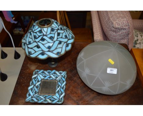 An Art Deco frosted glass light shade together with a Tiffany style lamp and similar dish 