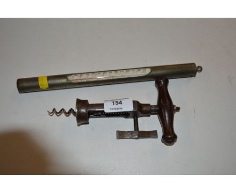 A wooden handled and steel corkscrew together with a thermometer