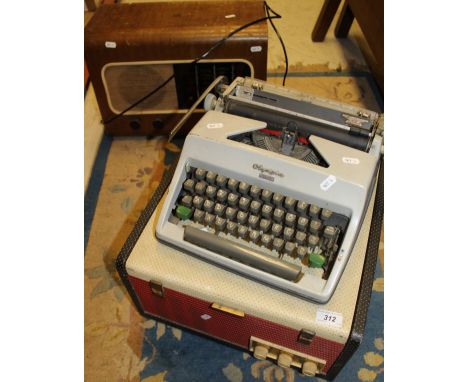 An Olympia Monica manual typewriter, an Ekco record player and a walnut cased Pye radio