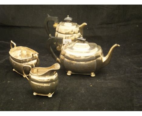 A George V silver four piece tea service comprising teapot, water pot, water jug, twin handled sucrier and milk jug or rectan