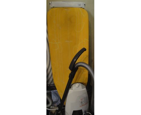 A Laurastar Magic Eye F6 ironing board, together with a Tefal Express iron and a Sebo Airbelt K Komfort vacuum cleaner and a 