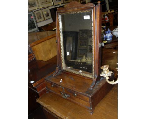 A 19th Century mahogany toilet mirror, the rectangular plate on a three drawer base to ogee bracket feet