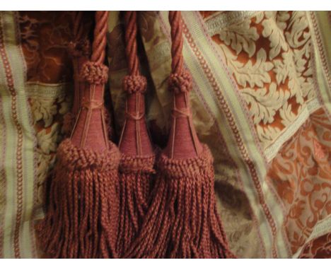 A pair of cotton gold and red patterned curtains, together with a pair of coordinating gold silk curtains and a pair of red t