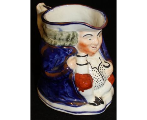 An Allertons character jug as a seated Toby with ale mug and snuff box