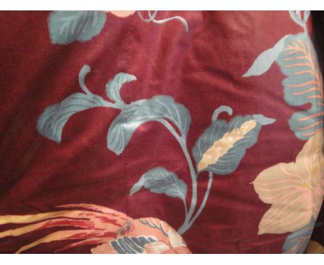 A collection of curtains and fabrics to include a pair of glazed cotton curtains, the burgundy ground with floral decoration 