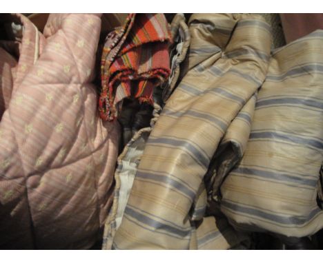 A collection of textiles to include pink and floral decorated bed throw, a pair of glazed cotton inter-lined striped curtains