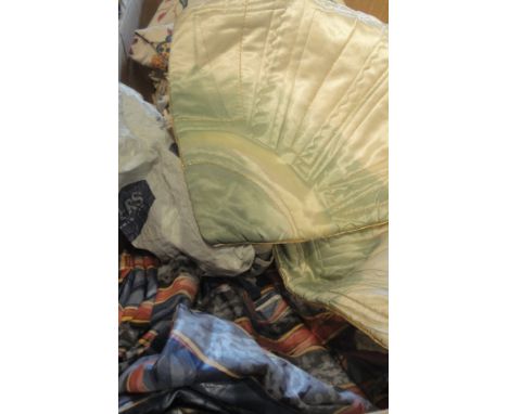 A box containing assorted vinage material and curtains, bed throws etc, together with two mid-20th Century cushion covers in 