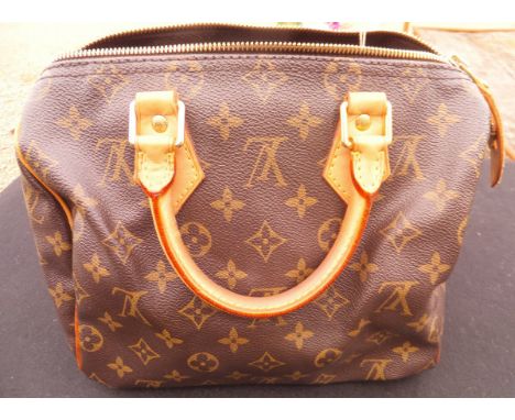 A Louis Vuitton handbag   CONDITION REPORTS  The Louis Vuitton handbag has general wear and tear conducive with age and use. 