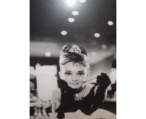 A collection of black and white posters to include Audrey Hepburn as Holly Golightly, etc, together with a collection of wick