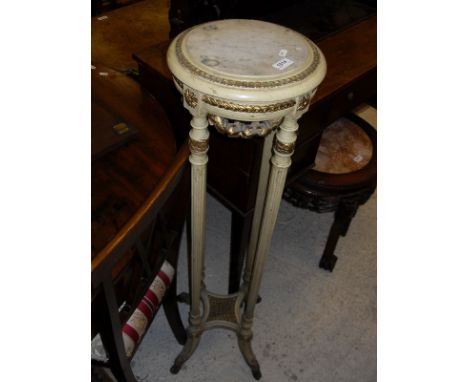 A marble top and painted torchere in the Louis XVI manner, a mahogany three tier waterfall open bookshelf, a Venetian gilded 