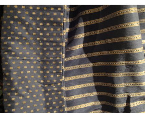 A pair of silk curtains with interlining of navy and gold design, together with a larger coordinating curtain