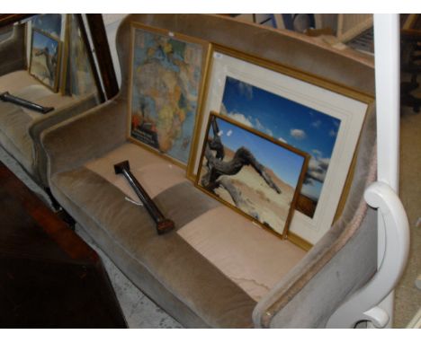 An Edwardian two seat sofa in fawn upholstery with square sectioned tapering legs to brown china castors