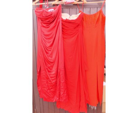 A Christian Dior red evening gown, together with a Valentino red evening gown and an After Six red evening gown with beaded d