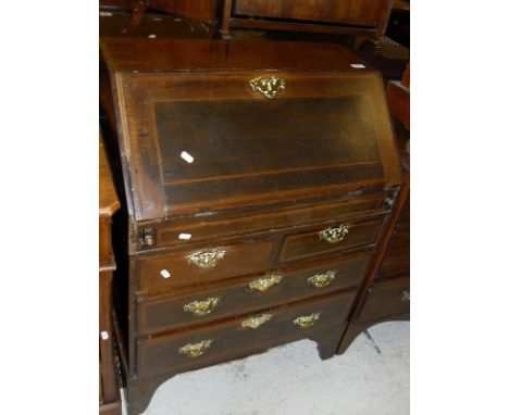 A 19th Century mahogany and inlaid bureau, the sloping fall enclosing a fitted interior with well over two short and two long