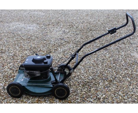 A Hayter Harrier petrol law mower with a Briggs and Stratton engine