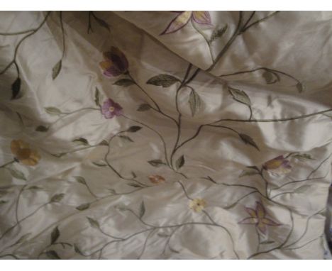 A pair of Marvik silk interlined curtains, the cream ground with built in "Malabar Kafila" pattern embroidered floral decorat
