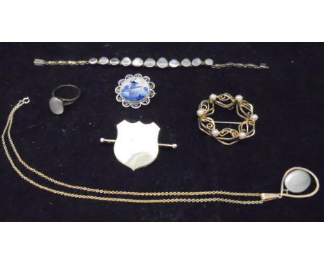 A collection of jewellery comprising a yellow metal and moonstone set bracelet, ring and matching pendant, together with a 12