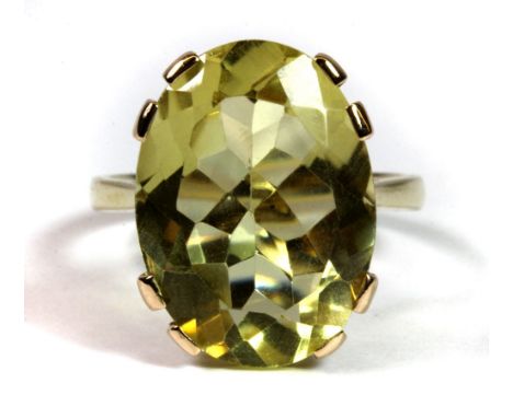 A 9ct yellow gold ring set with an 11ct light yellow citrine. (O).