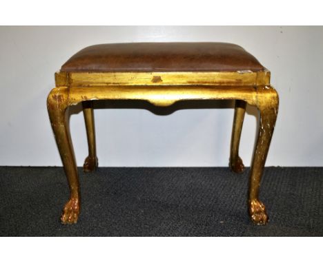 A leather topped gilt wood stool.