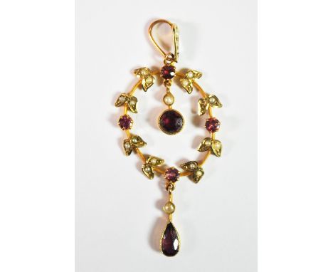 An Edwardian 9ct gold almandine garnet and seed pearl pendant.