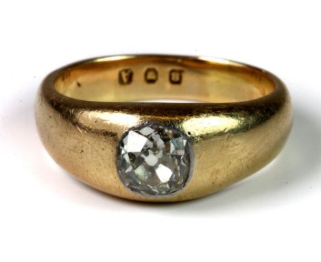 A heavy yellow metal gents ring set with a 1.38 carat cushion cut solitaire diamond, (R).