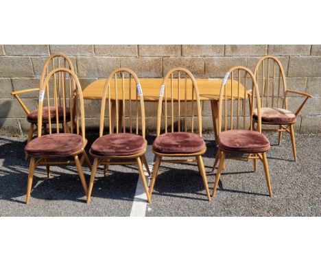 Ercol light elm and beech Windsor dining table, model no.382, 153cm long x 76cm wide x 72cm high and a set of six Ercol light