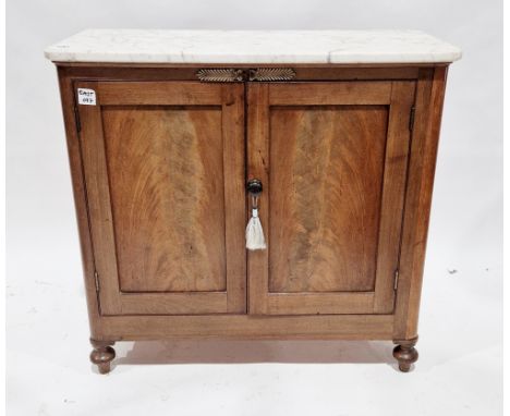 19th century French marble topped mahogany cupboard&nbsp;with rounded corners and gilt metal mounts, the two panel doors open