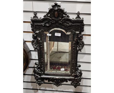 Late 19th century French bronze mirror&nbsp;in the renaissance revival manner, the cast embossed frame decorated with face ma