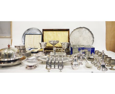 Collection of silverplate and metalware including various flatware, basting spoon, muffin dish, coasters and place mats, wine