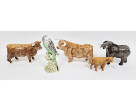 Two Beswick pottery models of Highland cattle, a calf, an elephant and a model of a green budgie perched on a tree stump, var