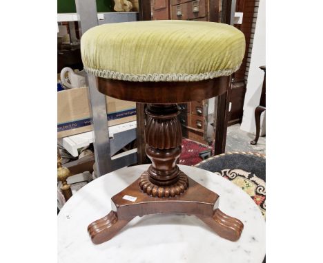 William IV/early Victorian mahogany circular piano stool&nbsp;with upholstered seat and raised on a turned reeded baluster su