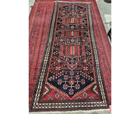 Iranian rug, very tribal to region, unusual pattern to centre with green, red, cream and brown with orange, blue and red colo