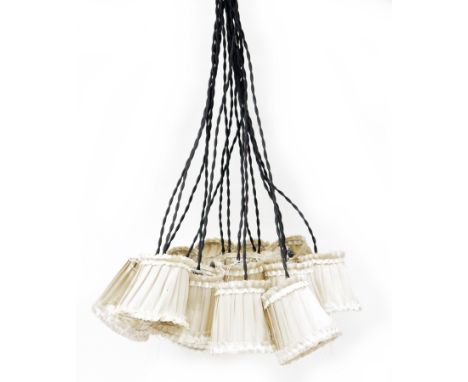 Contemporary multi-strand pendant light fitting retailed by ABC store in New York comprising sixteen hanging wires fitted wit