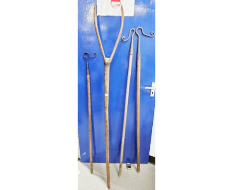 Three antique shepherd's crooks, possibly Scottish, with iron hooks and long turned wooden handles together with an antique w