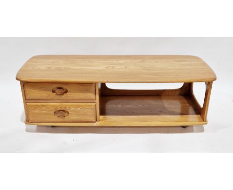 Ercol light elm Minerva coffee table, model no.844, with open shelf below and two drawers, raised on castors, 124.5cm long x 