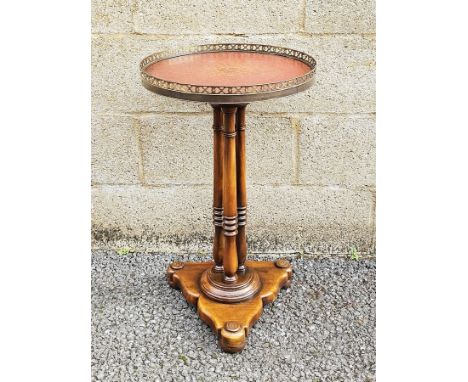 Theodore Alexander Louis XVI style circular lamp table, the circular leather inset top with pierced gilt metal gallery rail, 