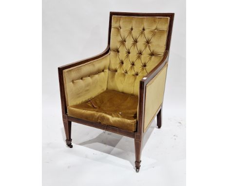 Edwardian mahogany inlaid armchair with gold coloured button back upholstery, raised on square legs terminating in castors, 6
