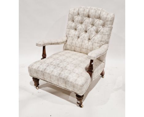 Late 19th/early 20th century button back upholstered armchair, the walnut frame having turned arm supports and turned legs te
