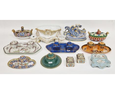 Collection of English and Continental pottery and porcelain inkwells and stands, late 19th/early 20th century, including: a m