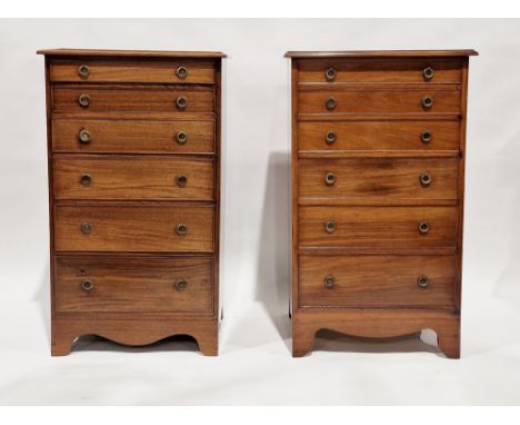 Pair of rosewood chests of six graduated long drawers, each with brass drop ring handles, with shaped aprons and splayed brac