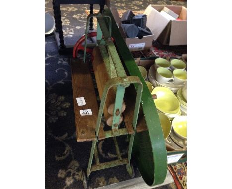 An early 20th century child's toy mangle together with a Bagatelle board.