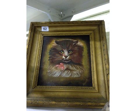 A gilt framed oil on board: Portrait of a Cat.