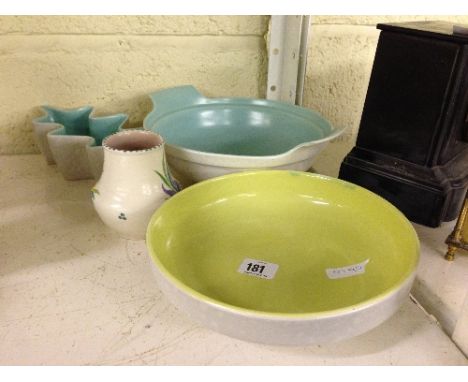 Four various Poole Pottery items.
