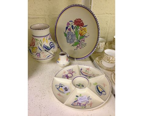 Four various white bodied Poole Pottery items.