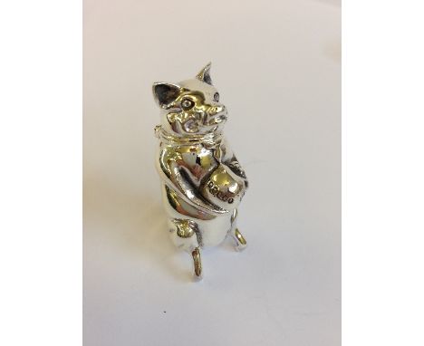 A silver Vesta case modelled as a Pig holding a money bag.