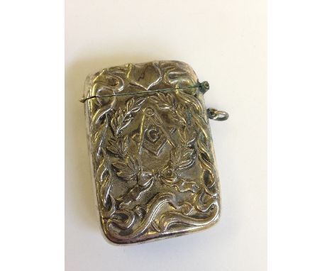 A silver Vesta case with embossed Masonic emblem.